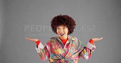 Buy stock photo Portrait, open hands and woman in studio, offer and comparison on grey background. Face, person or model with gesture, question or shrug with decision, mockup option or choice with selection or smile