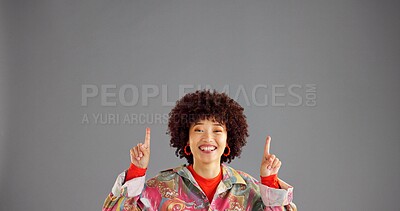 Buy stock photo Portrait, happy woman and pointing up for advertising fashion, mockup info and discount deal. African person, marketing and show space for retro sales, promotion and offer on gray studio background