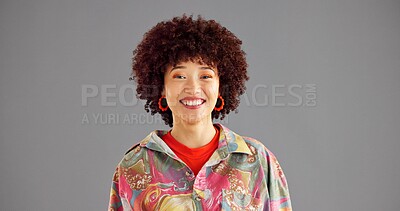 Buy stock photo Urban, fashion and studio portrait of woman with smile, confidence and cool afro style at university. Happy, space and student girl with streetwear, mockup and positive attitude on grey background