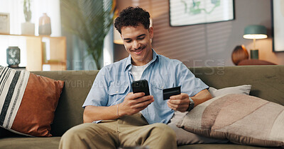 Buy stock photo Home, online shopping and man with smartphone, card and payment for digital product, sale and browsing. House, customer and person with credit for ecommerce, living room and scroll for purchase