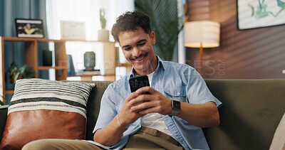 Buy stock photo Relax, smile and man on smartphone on sofa for communication, chat or reading message. Home, online and happy person on internet for texting, social media and browsing website to download application