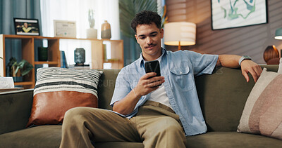 Buy stock photo Relax, smile and man with mobile in home for communication, chat and reading message. Sofa, online and happy person with smartphone for texting, social media and browsing website to download app