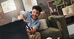 Happy, gamer and man with controller, living room and fun with tech for entertainment, online and home. Digital, player and person with console for hobby, tv and streaming on website in lounge