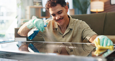 Buy stock photo Happy man, spray bottle and table with detergent for housekeeping or cleaning service at home. Male person, maid or cleaner with smile, gloves or cloth for bacteria or germ removal on glass surface