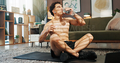 Buy stock photo Home, drinking water and man in lounge, fitness and relax with hydration, wellness and break. Apartment, shirtless and healthy person with liquid, thirsty and exercise with workout, tired and fatigue