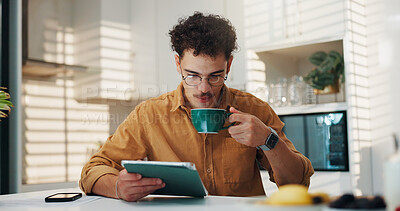 Buy stock photo Home, coffee and man with tablet, internet and online reading with morning news. Apartment, tech and person in kitchen, connection and herbal tea with social media, email notification and mocha brew