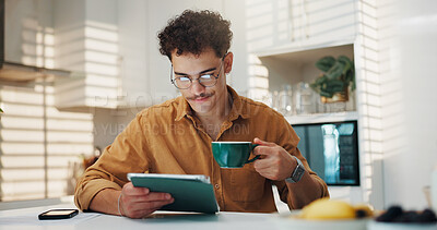 Buy stock photo Home, coffee and man with tablet, online reading and email notification with morning news. Apartment, tech and person in kitchen, connection and herbal tea with social media, chatting and research