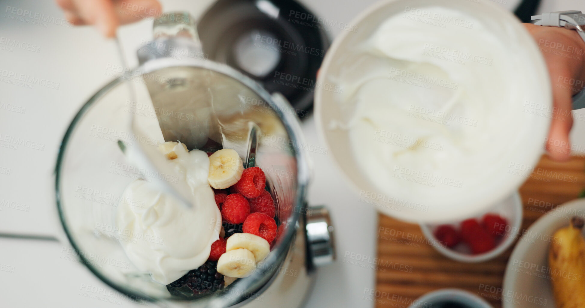 Buy stock photo Fruit smoothie, hands and yogurt in blender for breakfast shake, meal replacement and healthy nutrition. Above, machine and preparation in kitchen for weight loss beverage, person diet and wellness