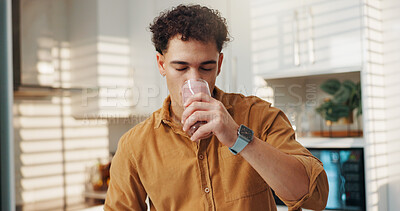 Buy stock photo Man, drinking and self care in home with smoothie, protein shake and beverage for gut health. Nutritionist, enjoy and glass in kitchen with detox diet, vitamin booster and benefits of meal supplement