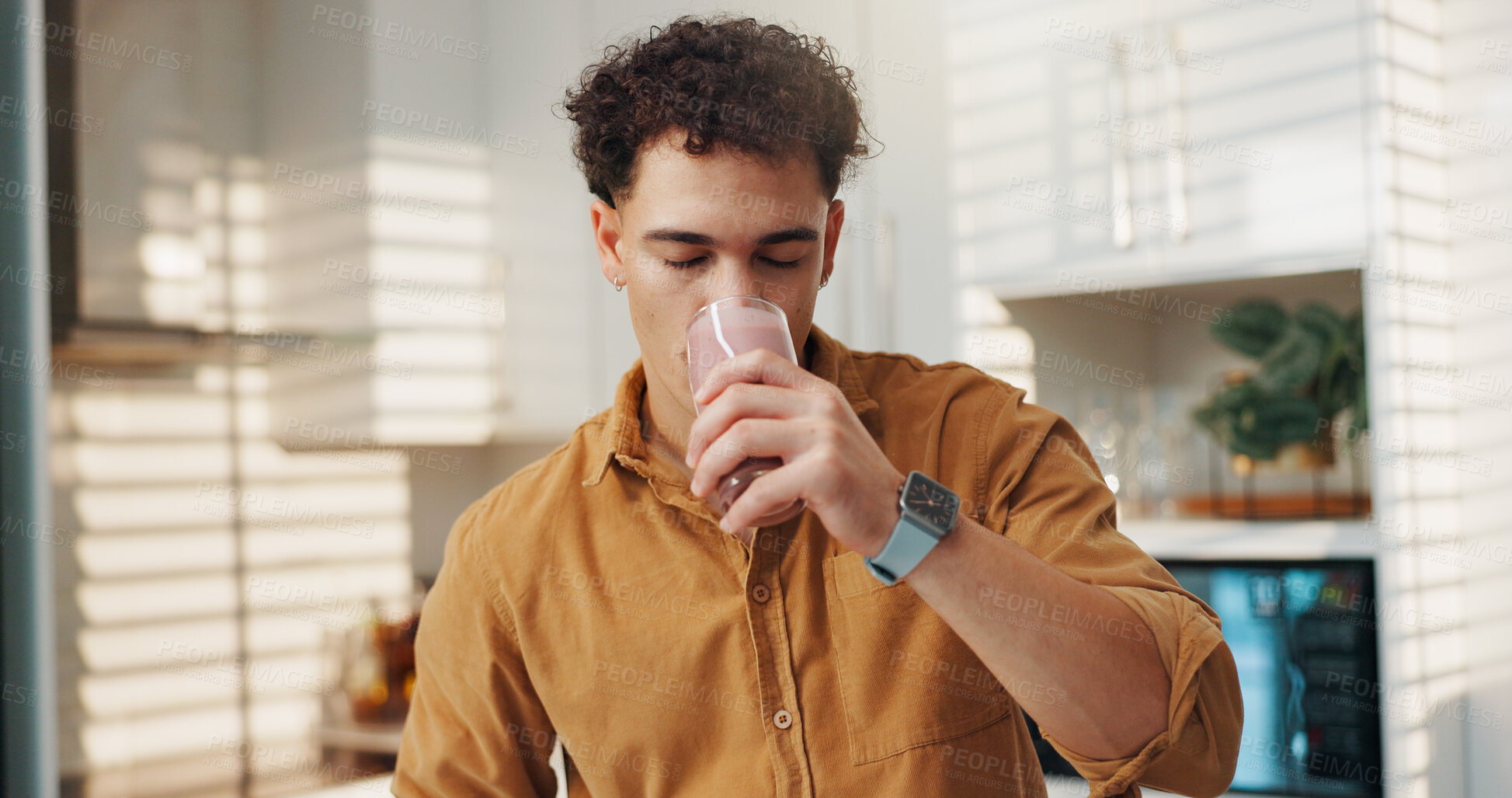 Buy stock photo Man, drinking and self care in home with smoothie, protein shake and beverage for gut health. Nutritionist, enjoy and glass in kitchen with detox diet, vitamin booster and benefits of meal supplement