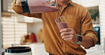 Hands, smoothie and man in kitchen, blender and nutrition with wellness, fruit drink and gut health. Benefits, closeup and person with organic ingredients, detox and weight loss with vitamins or home