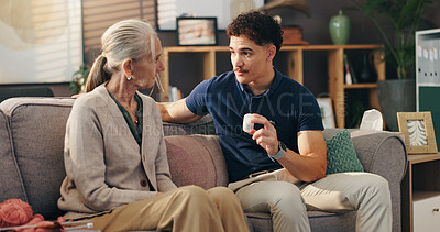 Buy stock photo Caregiver, senior woman and pills on sofa with medication instructions, tablets dosage and illness management. Homecare, old person and healthcare worker with prescription drugs for health treatment