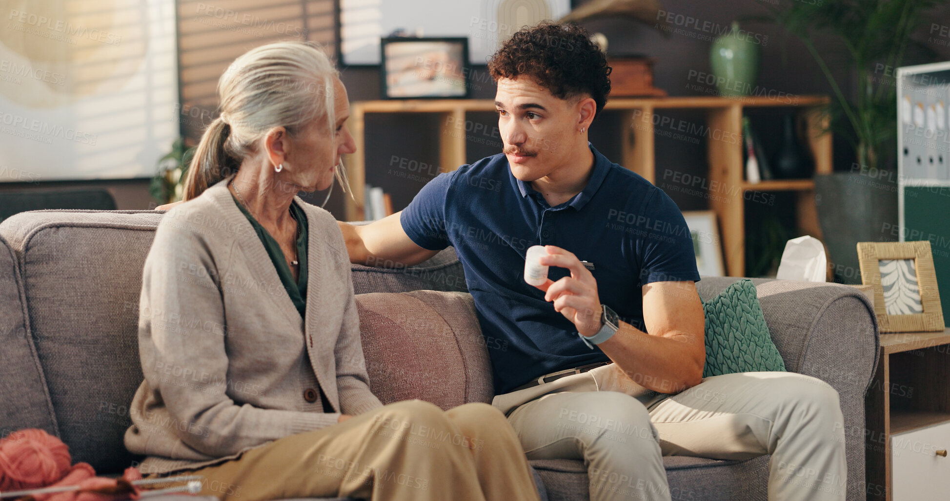 Buy stock photo Caregiver, senior woman and pills on sofa with medication instructions, tablets dosage and illness management. Homecare, old person and healthcare worker with prescription drugs for health treatment