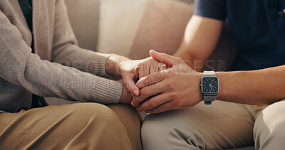 Buy stock photo Senior, person and holding hands with caregiver on sofa for empathy, retirement support and compassion. Closeup, patient and health worker in assisted living with comfort and console for medical news