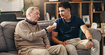 Caregiver, senior man and pills in home with supplements medication, tablets dosage and illness management. Homecare, old person and healthcare worker with prescription drugs for medical treatment