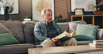 Buy stock photo Senior man, reading book and relax on sofa with study, literature and information in lounge at apartment. Elderly person, novel and knowledge on couch with language for storytelling in living room