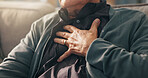 Home, hands and old man with chest pain, discomfort and cardiac symptoms in lounge. Closeup, pensioner or elderly person with heart attack signs, retirement and viral infection with illness or asthma