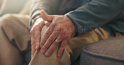 Buy stock photo Hands, knee pain and senior person on sofa in living room of apartment with arthritis or osteoporosis. Inflammation, injury or joint problem with old man in retirement home closeup with fibromyalgia