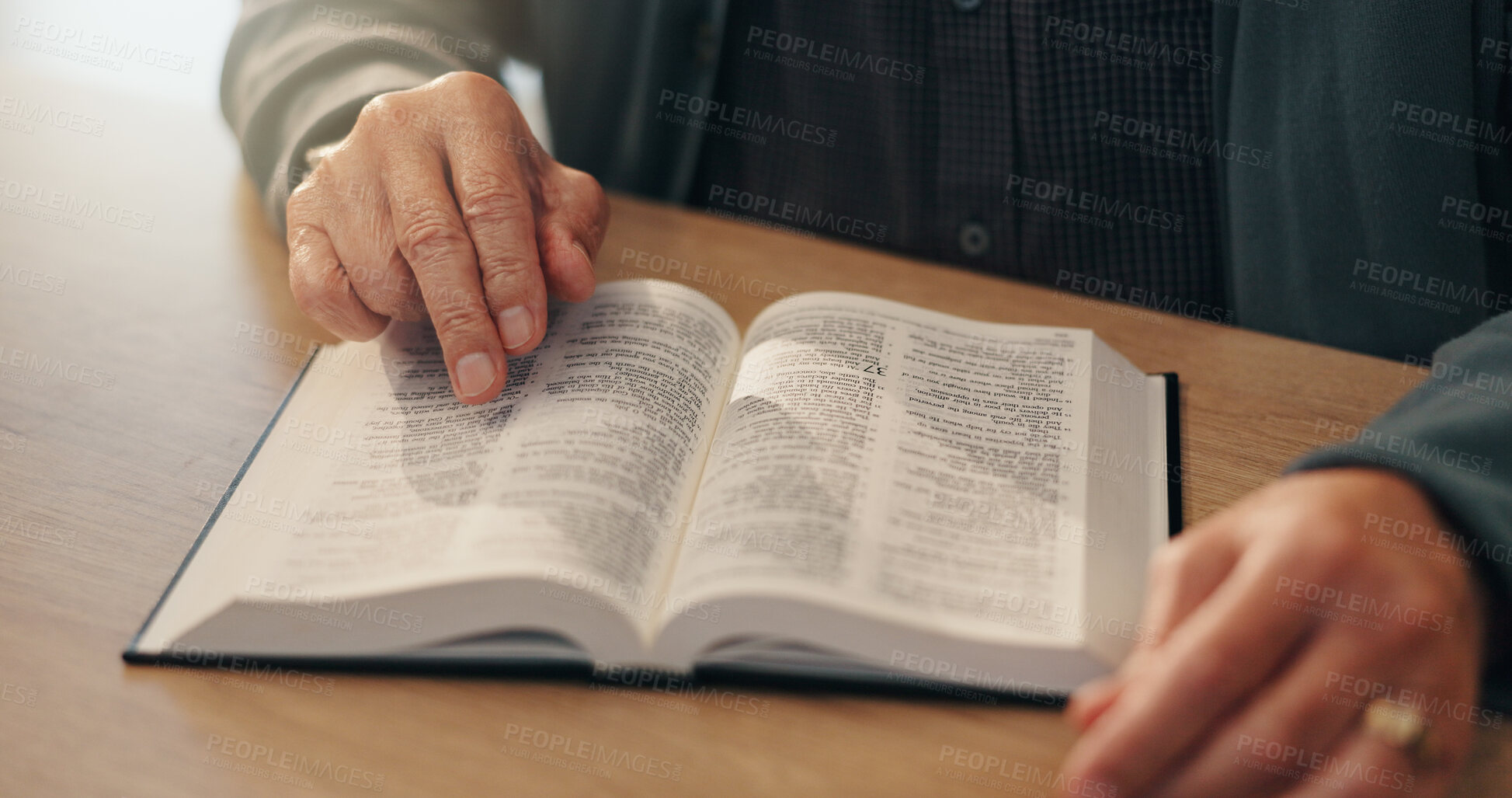 Buy stock photo Hands, bible study and faith in home, retirement and reading with scripture, info and spiritual knowledge. Elderly person, book and religion with language, learning and gospel for God at apartment