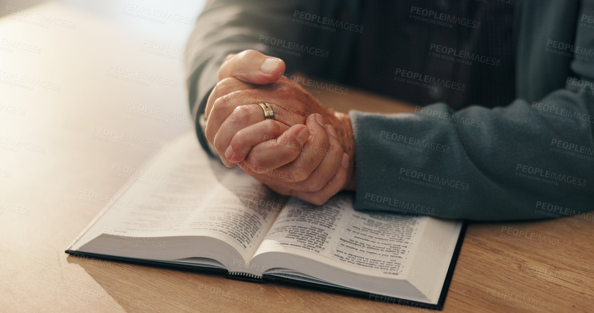 Buy stock photo Hands, bible study and religion in home, retirement and reading scripture for marriage, info and spiritual knowledge. Elderly person, book and faith with story, chapter or gospel for God at apartment