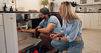 Plumber, man and woman by kitchen sink for pipe, inspection and check for leak for maintenance at house. People, handyman and client with assessment, repair and problem solving for drain at apartment