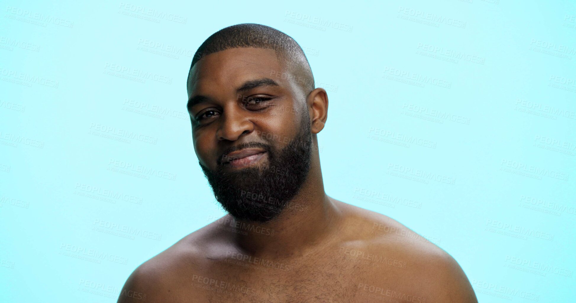 Buy stock photo Black man, portrait and confident in studio for skincare, face and grooming in morning. African person, dermatology and smile on blue background space for beard care, topless and hygiene in Nigeria