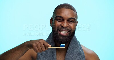 Buy stock photo Black man, smile and portrait with toothbrush for brushing teeth, dental health or bamboo in studio. Toothpaste, oral care and whitening with sustainable tool for mouth hygiene on blue background