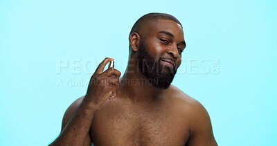 Buy stock photo Black man, spray or cologne for hygiene in portrait, fragrance or grooming with cosmetic product on blue background. Studio, perfume or spritz for scent, male person and self care with wellness space