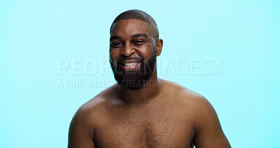 Buy stock photo Black man, portrait and smile in studio for skincare, confidence and grooming in morning. African person, dermatology and happy on blue background space for beard care, topless and hygiene in Nigeria