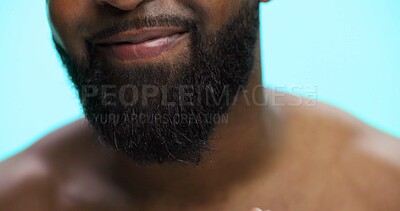 Buy stock photo Beard, beauty and mouth of black man on blue background for morning skincare routine. Grooming, masculinity and self care with person closeup in studio for personal hygiene, relax or wellness