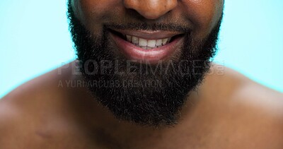 Buy stock photo Beard, grooming and mouth of black man on blue background for morning maintenance routine. Beauty, facial hair and self care with person closeup in studio for personal hygiene, relax or wellness