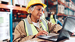 Woman, laptop and report for logistics at warehouse with review for order, info and inventory management. Mature person, pc and scroll for shipping, distribution or supply chain at industrial plant