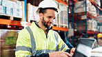 Man, laptop and typing for distribution at warehouse with review for order, smile and inventory management. Person, computer and scroll for shipping, logistics and supply chain at industrial plant