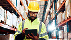 Black man, tablet and typing for distribution at warehouse with review for order, contact and inventory management. Person, touchscreen and app for shipping, logistics and supply chain at plant