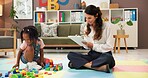Psychology, woman and girl with clipboard, blocks and happy for evaluation, assessment or writing on floor. Person, therapist and child with toys, playful and checklist for notes with smile at clinic