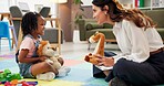 Psychology, woman and girl with dolls, talk and happy with clipboard for emotional assessment on floor. Person, therapist and child with toys, playful and checklist for test at mental health clinic