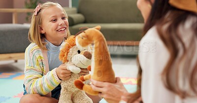 Buy stock photo Therapy, woman and girl with toys, consulting and listen with smile for emotional assessment on floor. Person, psychologist and child with dolls, evaluation and talk for test at mental health clinic