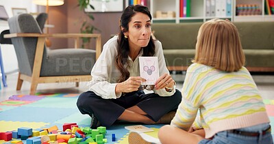 Buy stock photo Mom, girl and card for learning, letter and reading with support, sound and bonding on floor. Education, mother and daughter in living room for teaching, help and alphabet with care at family home