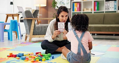 Buy stock photo Woman, girl and card with therapy for emotion, choice and happy emoji for mental health assessment on floor. Paper, therapist and child with decision for feelings, sign and evaluation at clinic