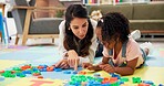 Psychologist, child and letters toys in office for mental health, examination or progress. Therapist woman, pediatrics and girl for wellness, clinic or consultation for patient support or development