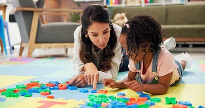 Buy stock photo Psychologist, child and letters toys in office for mental health, examination or progress. Woman, pediatrics and girl for wellness, speech therapy or consultation for patient support or development