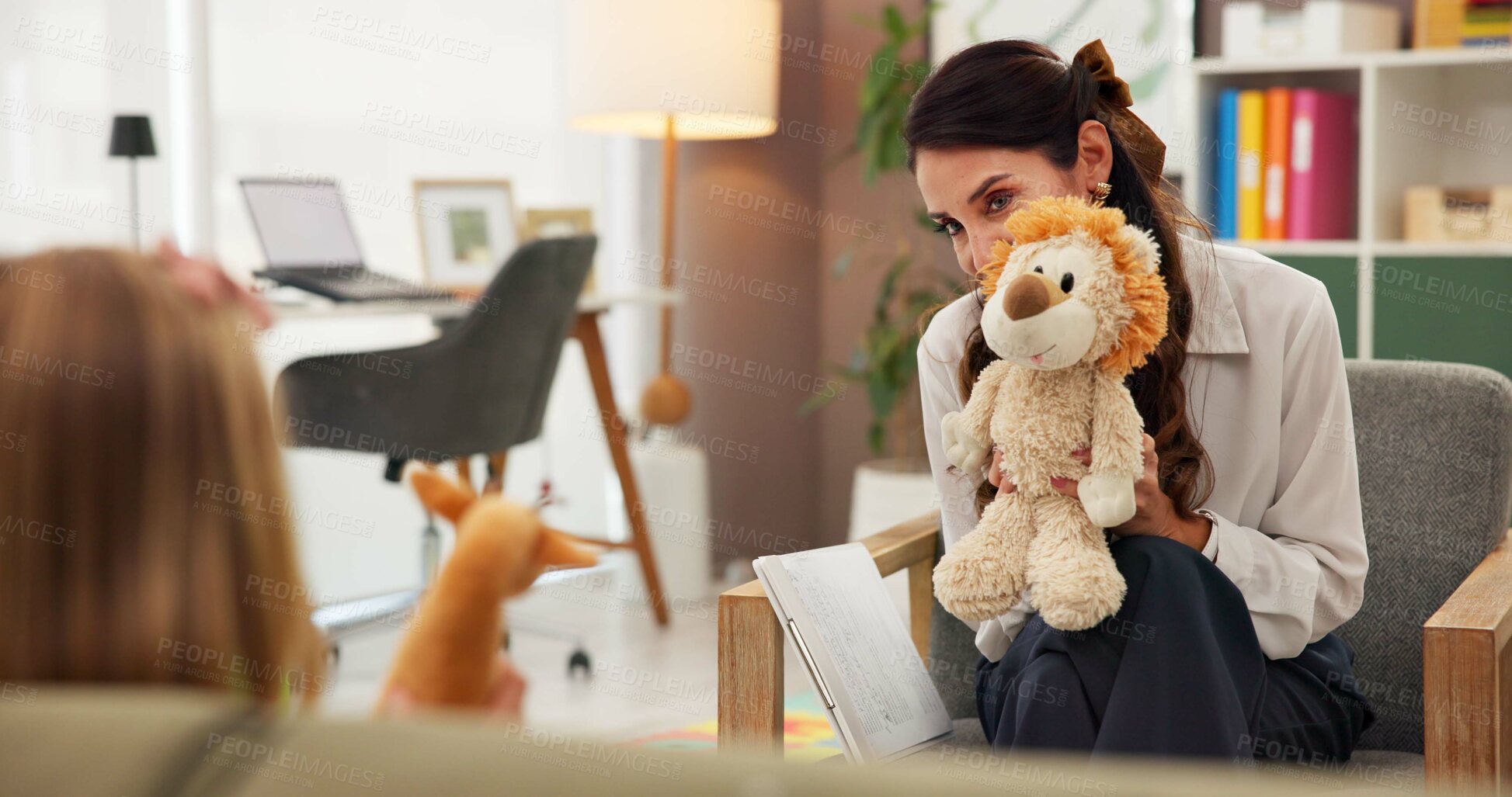 Buy stock photo Teddy bear, psychology and therapist with child in office for help with emotions, mental health or evaluation. Talk, appointment and female psychiatrist with fluffy toy for kid counseling at clinic.