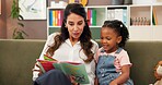 Psychologist, child and reading story in office for speech therapy, mental health and learning. Therapist woman, book and girl for evaluation, clinic or consultation for patient development support