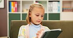 Girl, reading or sofa with tablet for elearning, education or lesson at private elementary school. Child, kid or student with technology or app on couch for childhood development, ebook or story time
