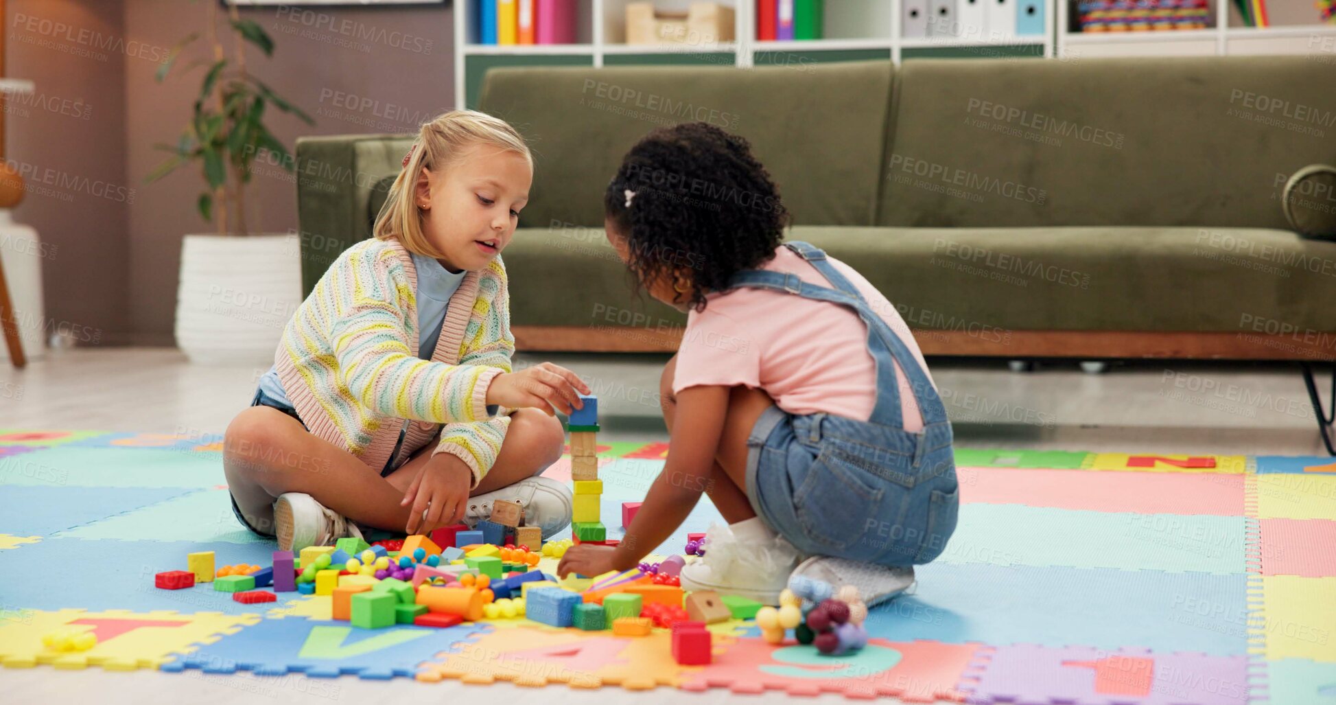 Buy stock photo Building blocks, fun and children in psychology waiting room with cognitive development or growth. Friends, creative and girl kids playing with educational toys for sensory or motor skills at clinic.