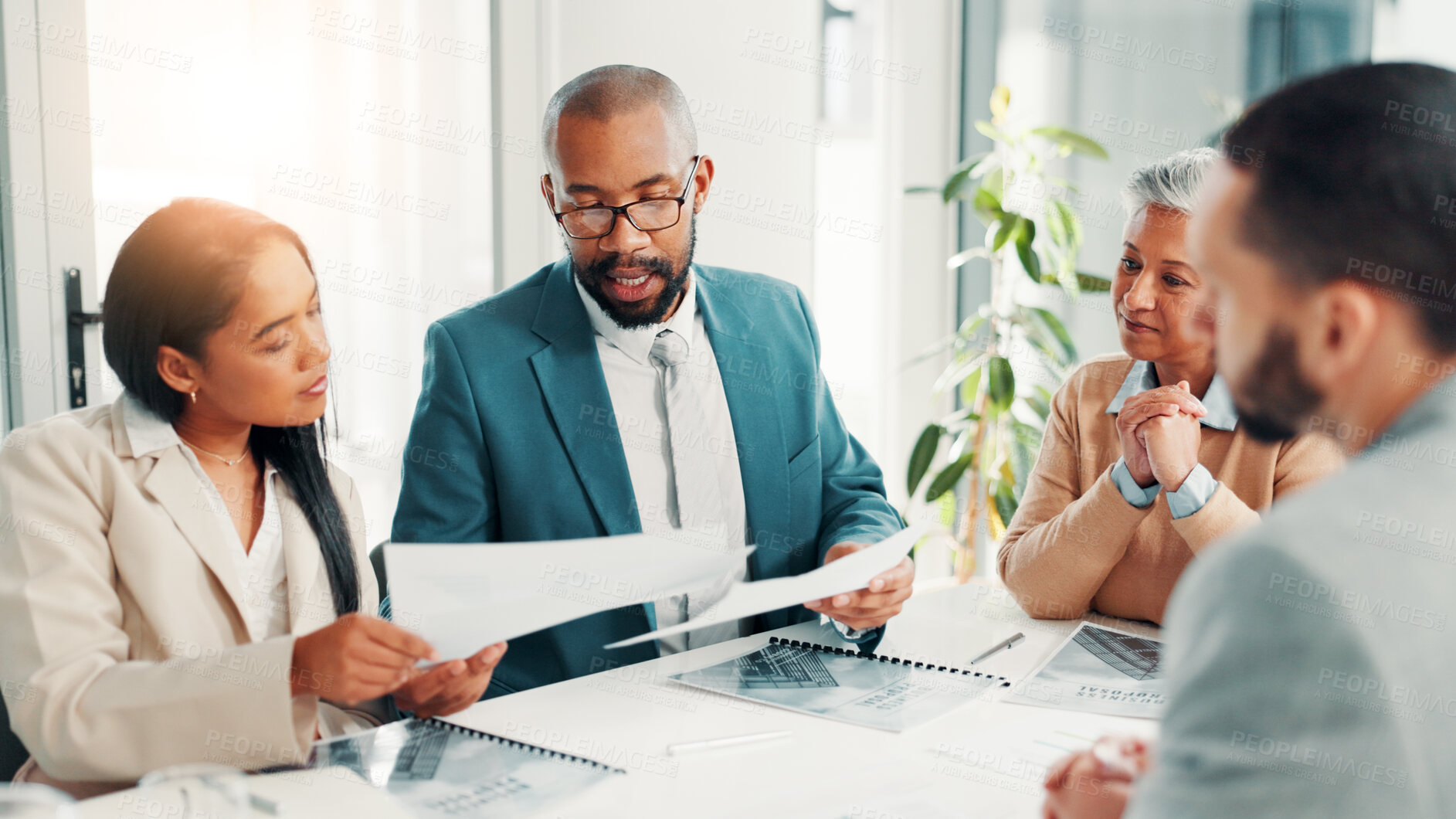 Buy stock photo Documents, interview and opportunity with business people in boardroom of office for hiring process. Human resources, recruitment and resume with employee team speaking to candidate for job vacancy