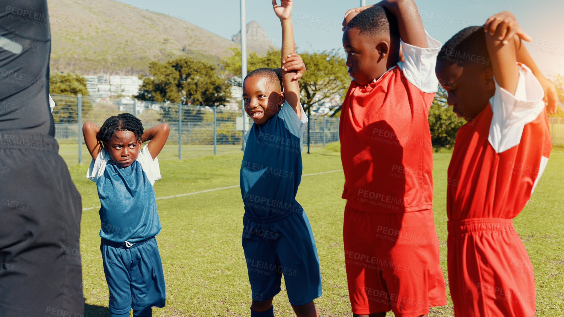 Buy stock photo Kids, black boys and stretching for soccer practice for fitness training, exercise and sports workout. Children, warm up and preparation for game, learning skills and team challenge of match activity