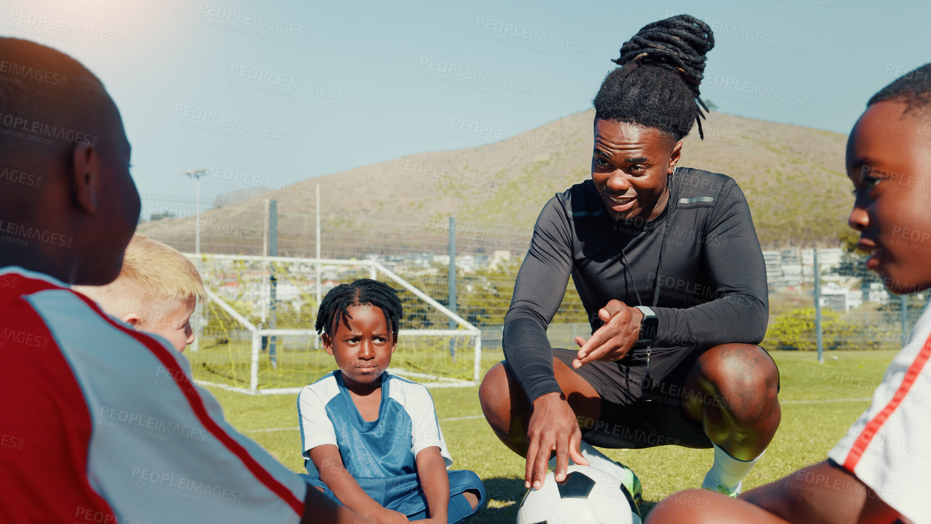 Buy stock photo Soccer, children and coach with ball for teamwork, training and formation on field. Man, football group and planning game for strategy, discussion and exercise for tournament or goal practice