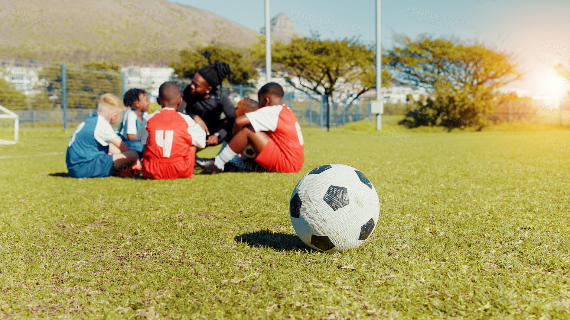 Buy stock photo Soccer, ball and children with coach for team huddle, training and formation on field. Man, football group and planning game for strategy, discussion and exercise for tournament or goal practice