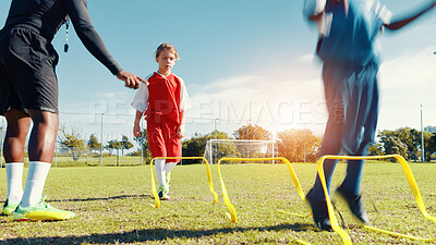 Buy stock photo Coach, children and jump for soccer practice for fitness training, balance exercise and sports workout. Kids, drills and hurdles for playing game, learning skills and team challenge of match activity